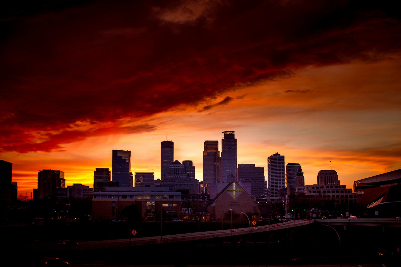 high rise buildings under cloudy sky