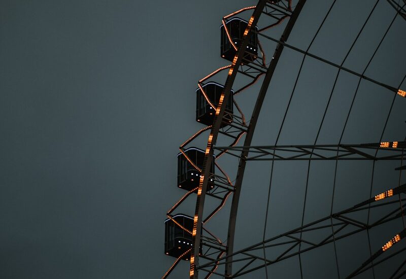 a large ferris wheel with lights on it