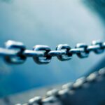 tilt shift lens photo of stainless steel chain